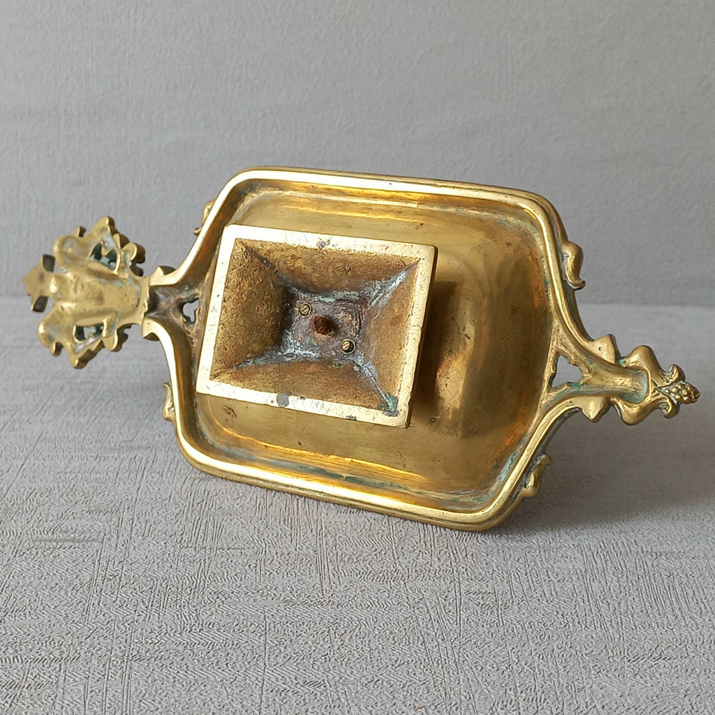 A French antique bronze/brass candle holder or chamber stick, a quality piece that is highly detailed with engraved patterns and a coat of arms with two lovely lions on the handle! This is a heavy piece for its small size and will make super home decor in any interior.