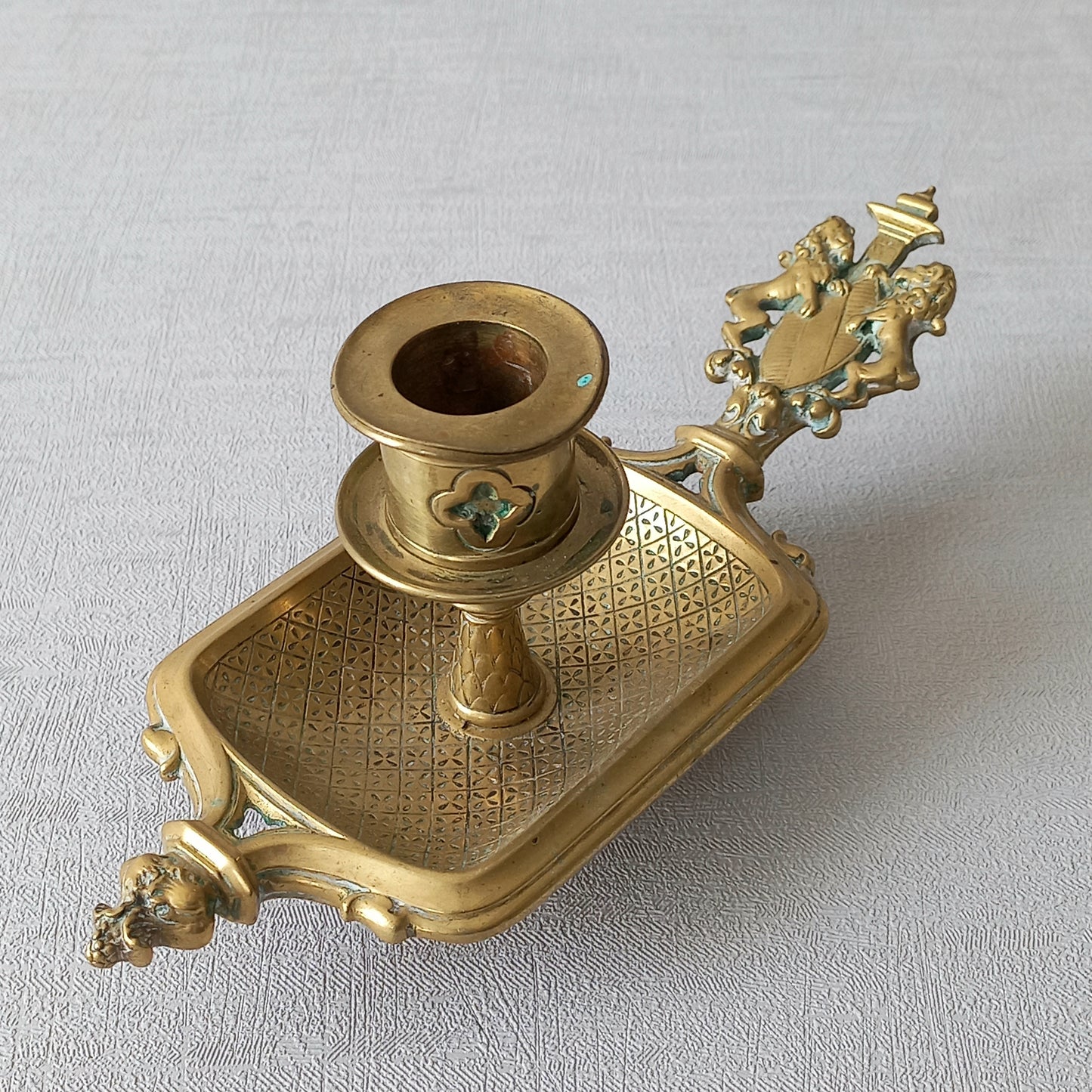 A French antique bronze/brass candle holder or chamber stick, a quality piece that is highly detailed with engraved patterns and a coat of arms with two lovely lions on the handle! This is a heavy piece for its small size and will make super home decor in any interior.