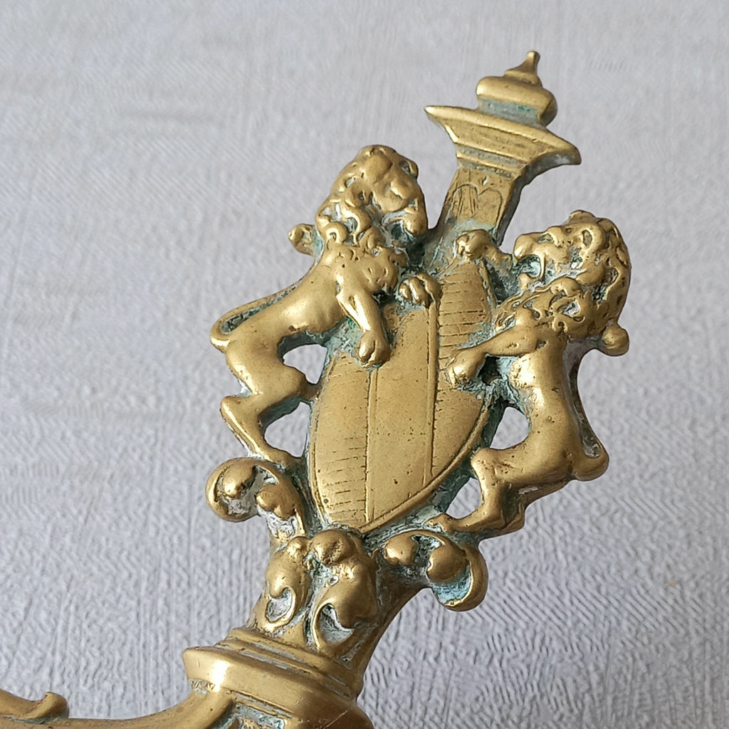 A French antique bronze/brass candle holder or chamber stick, a quality piece that is highly detailed with engraved patterns and a coat of arms with two lovely lions on the handle! This is a heavy piece for its small size and will make super home decor in any interior.