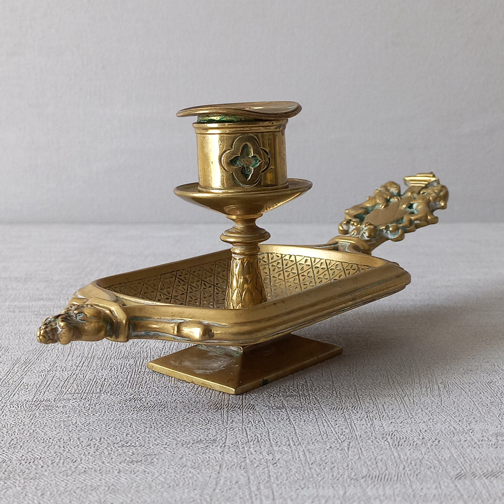 A French antique bronze/brass candle holder or chamber stick, a quality piece that is highly detailed with engraved patterns and a coat of arms with two lovely lions on the handle! This is a heavy piece for its small size and will make super home decor in any interior.