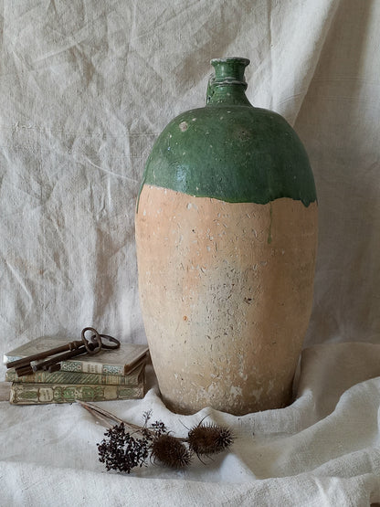 A rare and very large French antique stoneware preserving jar in a lovely shade of green over an earthy beige.
