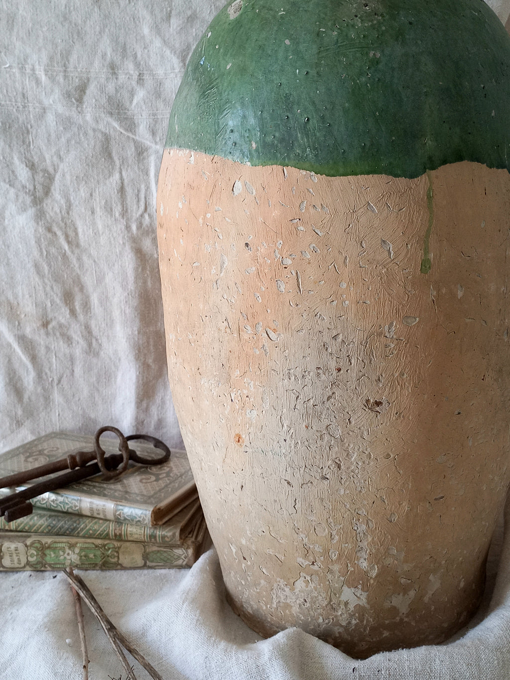 A rare and very large French antique stoneware preserving jar in a lovely shade of green over an earthy beige.

