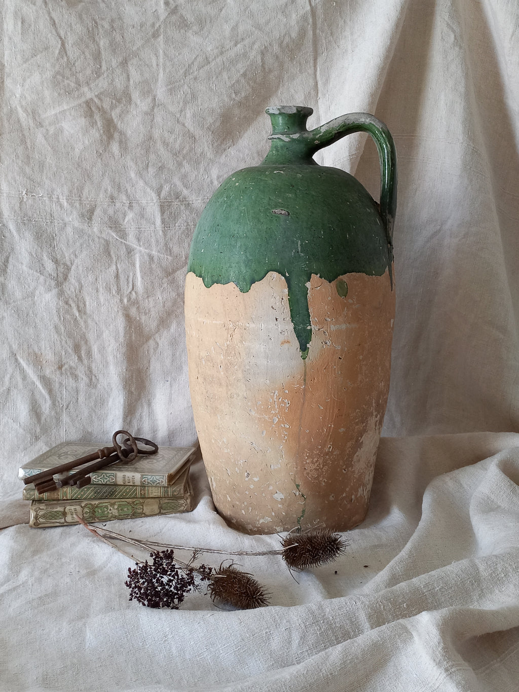 A rare and very large French antique stoneware preserving jar in a lovely shade of green over an earthy beige.
