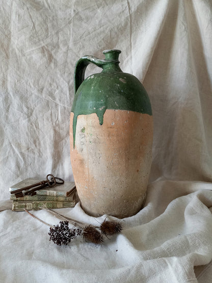 A rare and very large French antique stoneware preserving jar in a lovely shade of green over an earthy beige.
