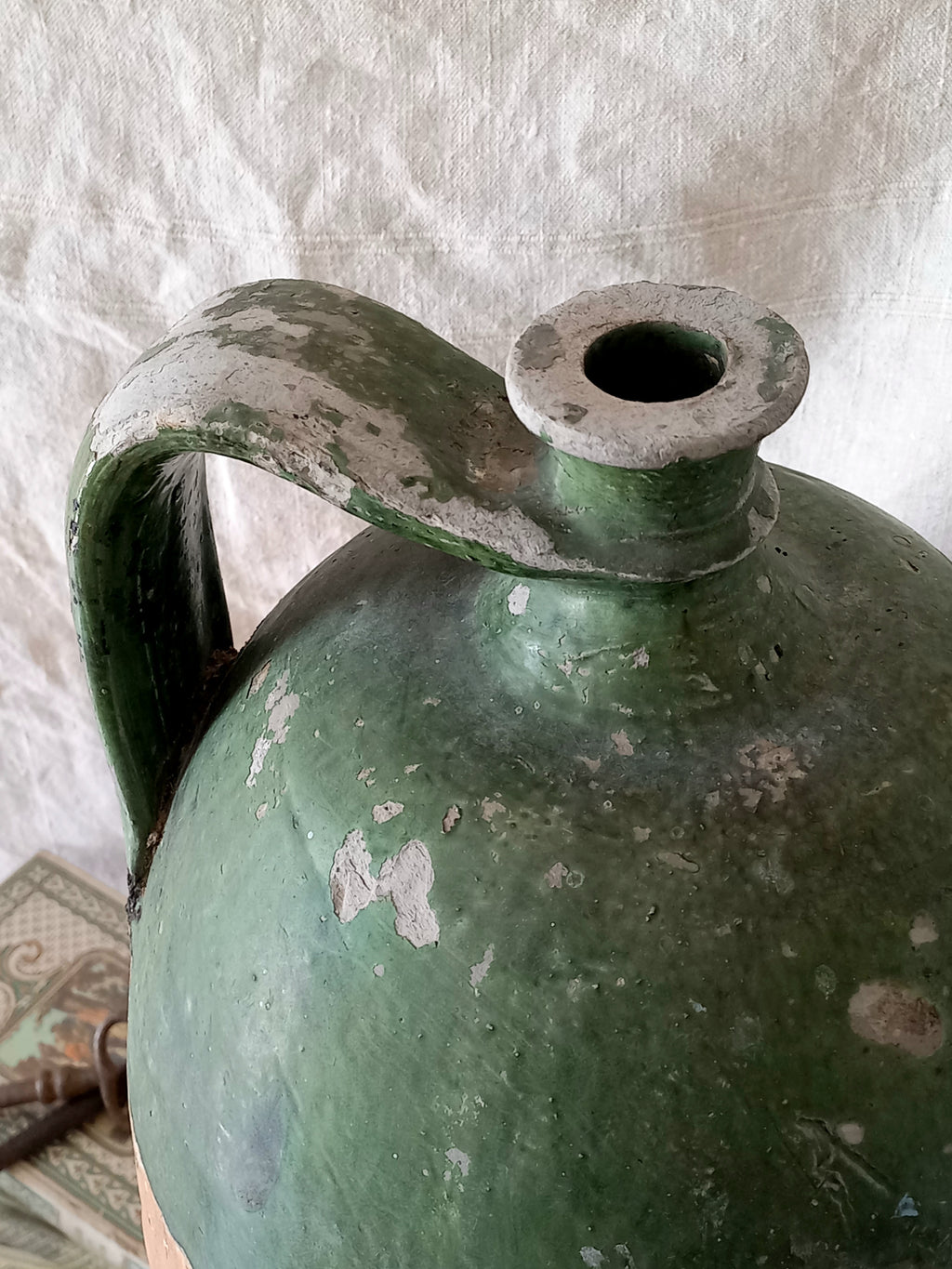 A rare and very large French antique stoneware preserving jar in a lovely shade of green over an earthy beige.
