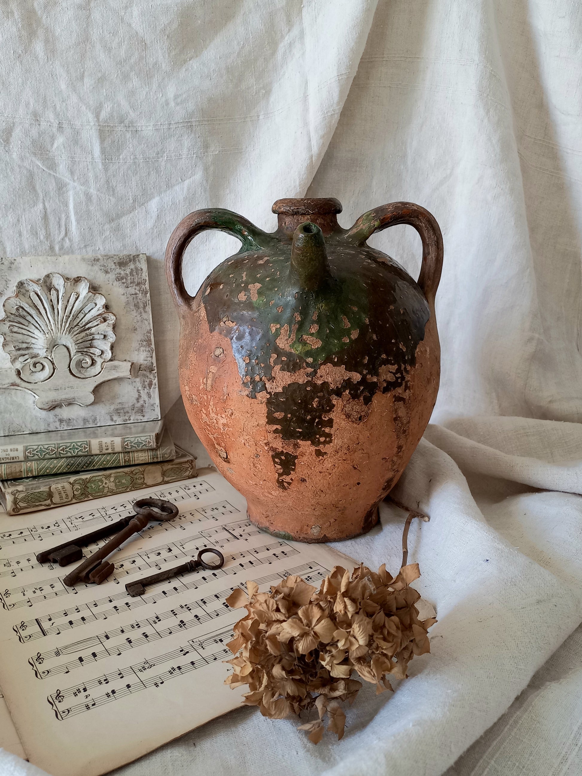 A stunning French antique stoneware terracotta oil preserving jar.