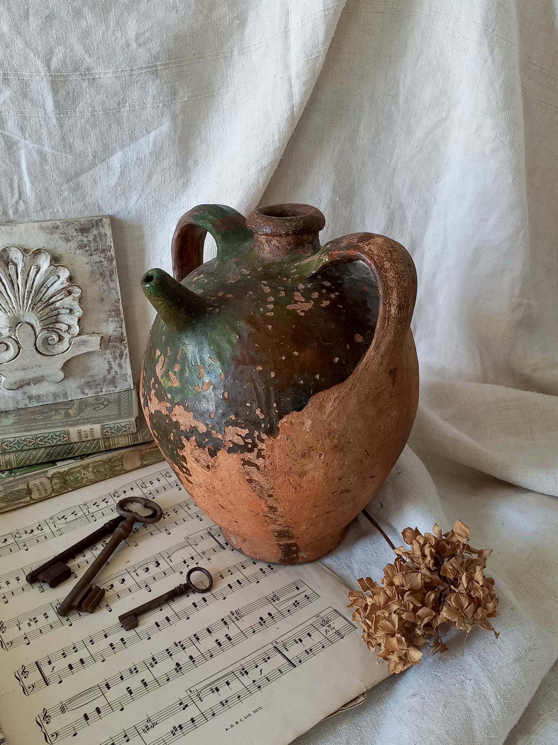 A stunning French antique stoneware terracotta oil preserving jar.