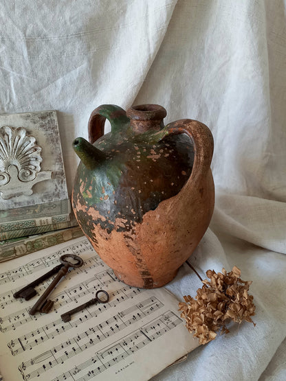A stunning French antique stoneware terracotta oil preserving jar.