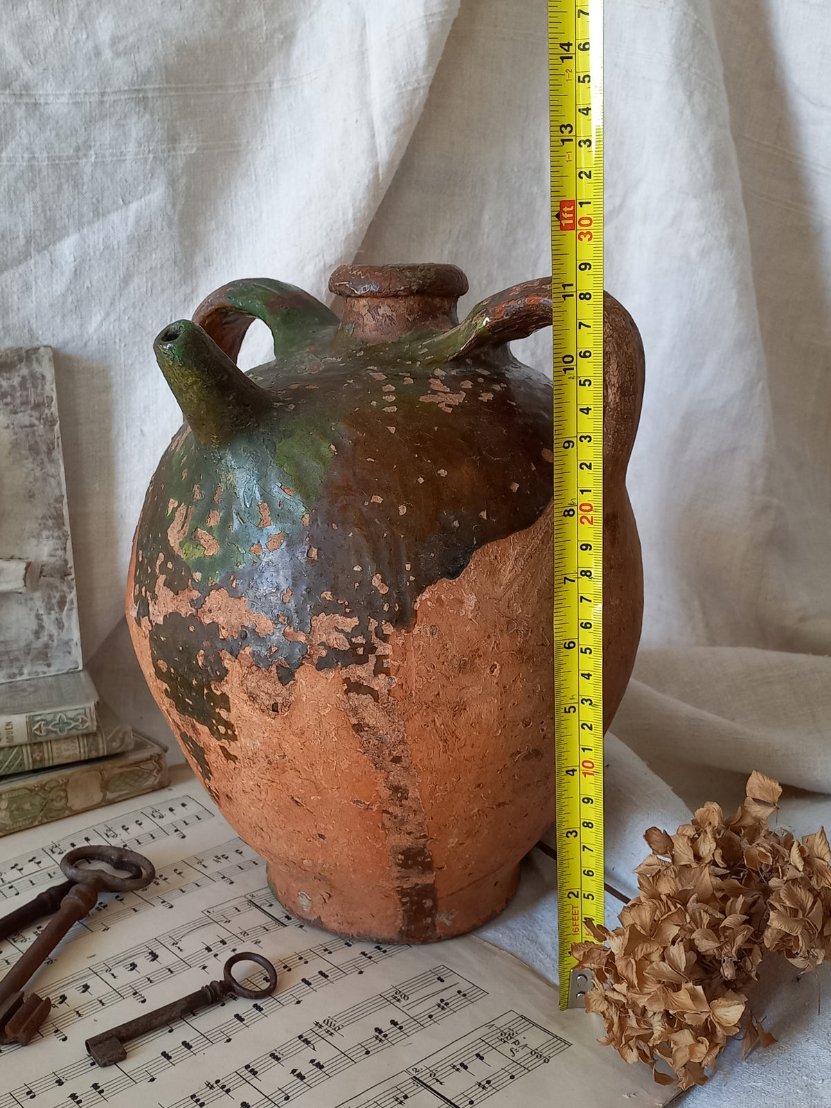 A stunning French antique stoneware terracotta oil preserving jar.
