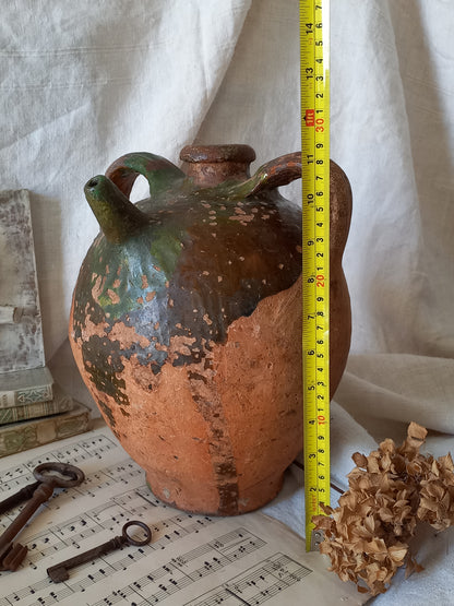 A stunning French antique stoneware terracotta oil preserving jar.