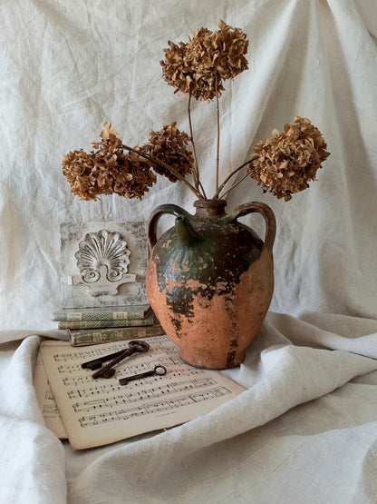 A stunning French antique stoneware terracotta oil preserving jar.