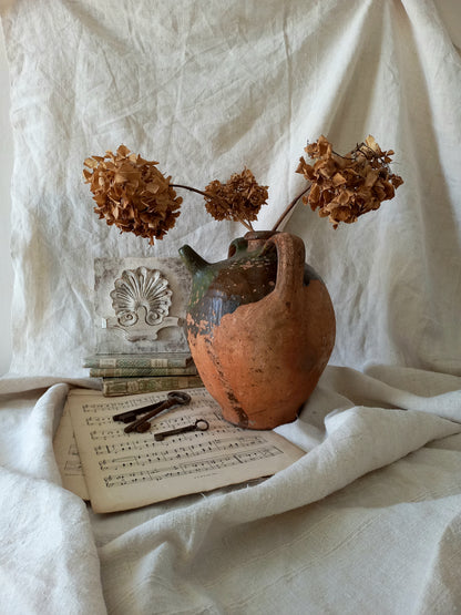 A stunning French antique stoneware terracotta oil preserving jar.