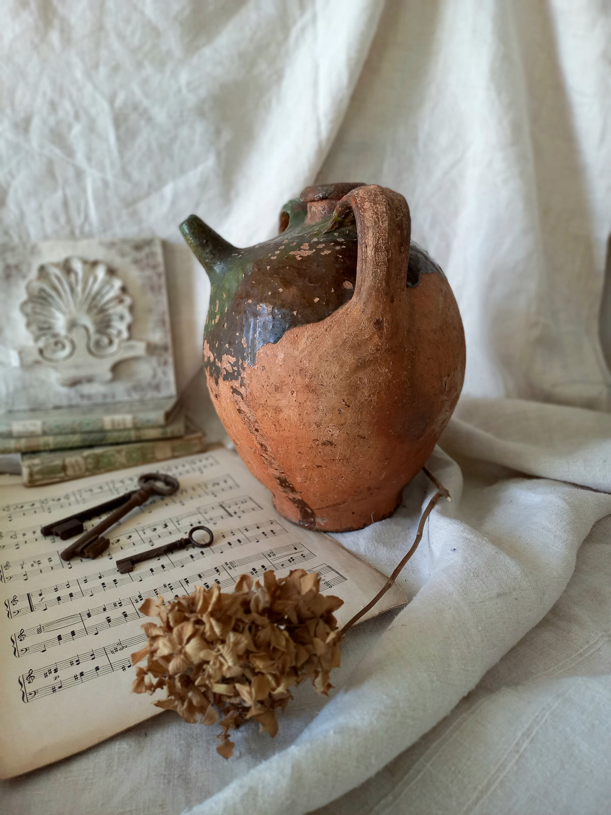 A stunning French antique stoneware terracotta oil preserving jar.