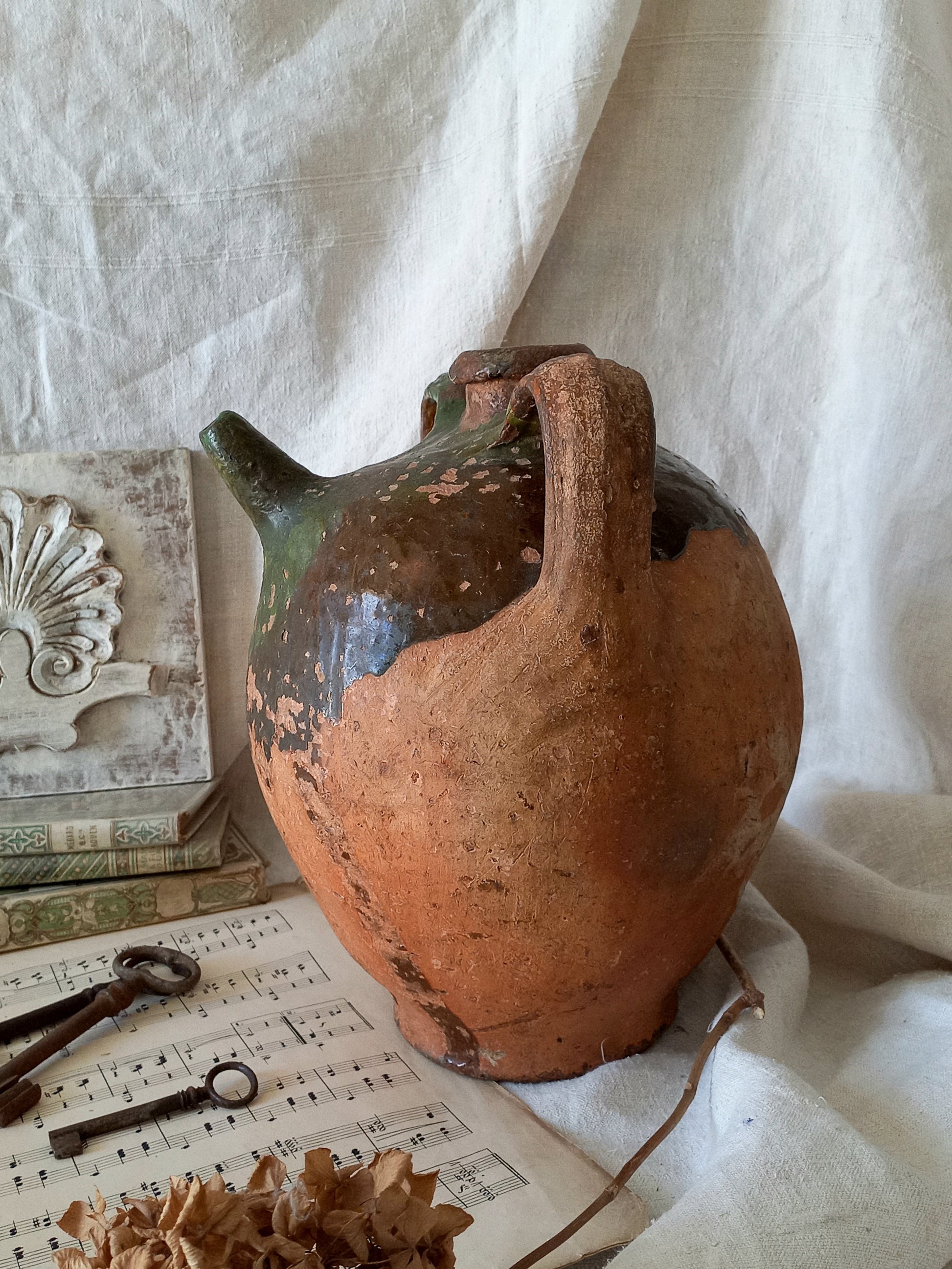 A stunning French antique stoneware terracotta oil preserving jar.