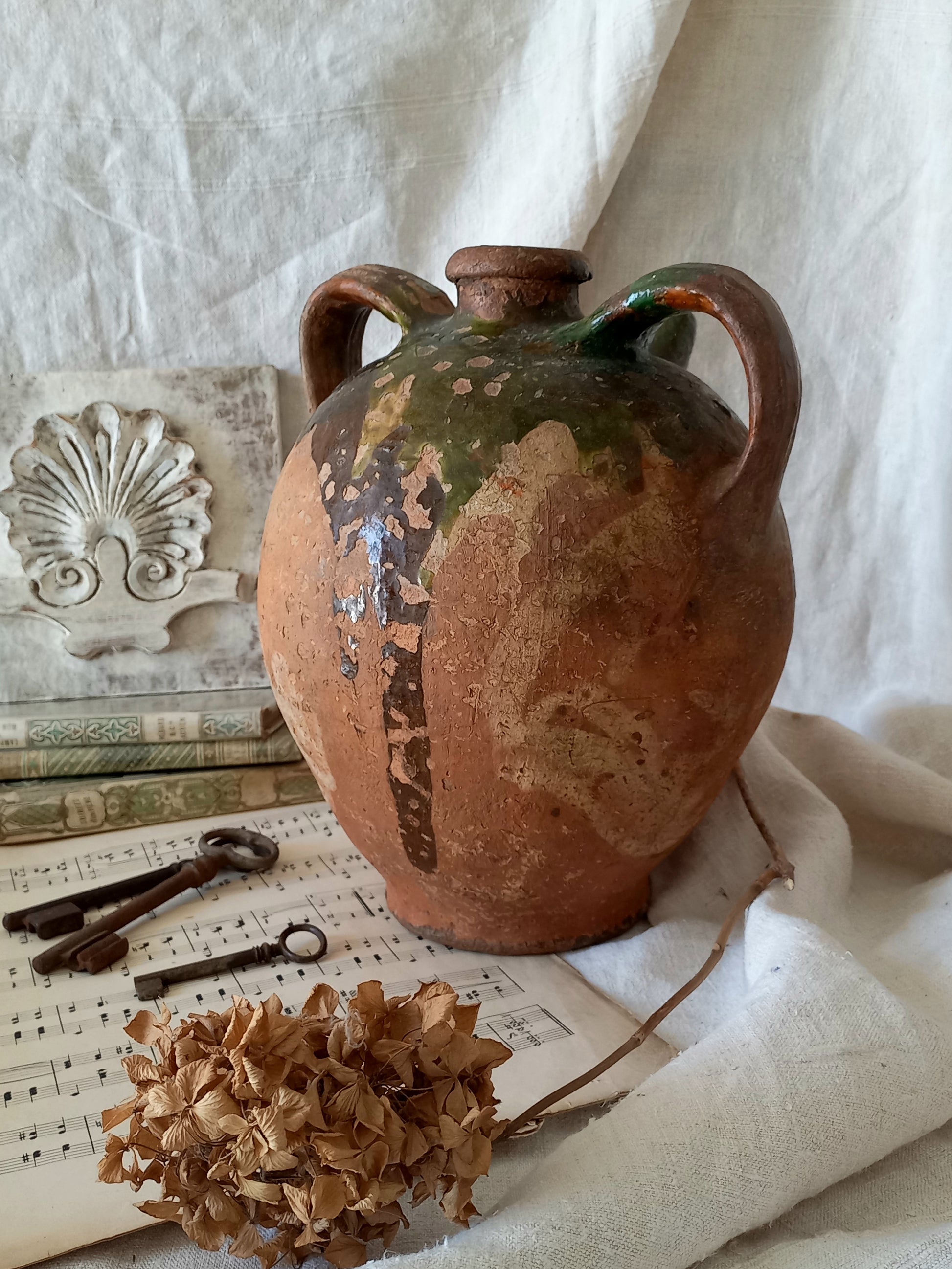 A stunning French antique stoneware terracotta oil preserving jar.
