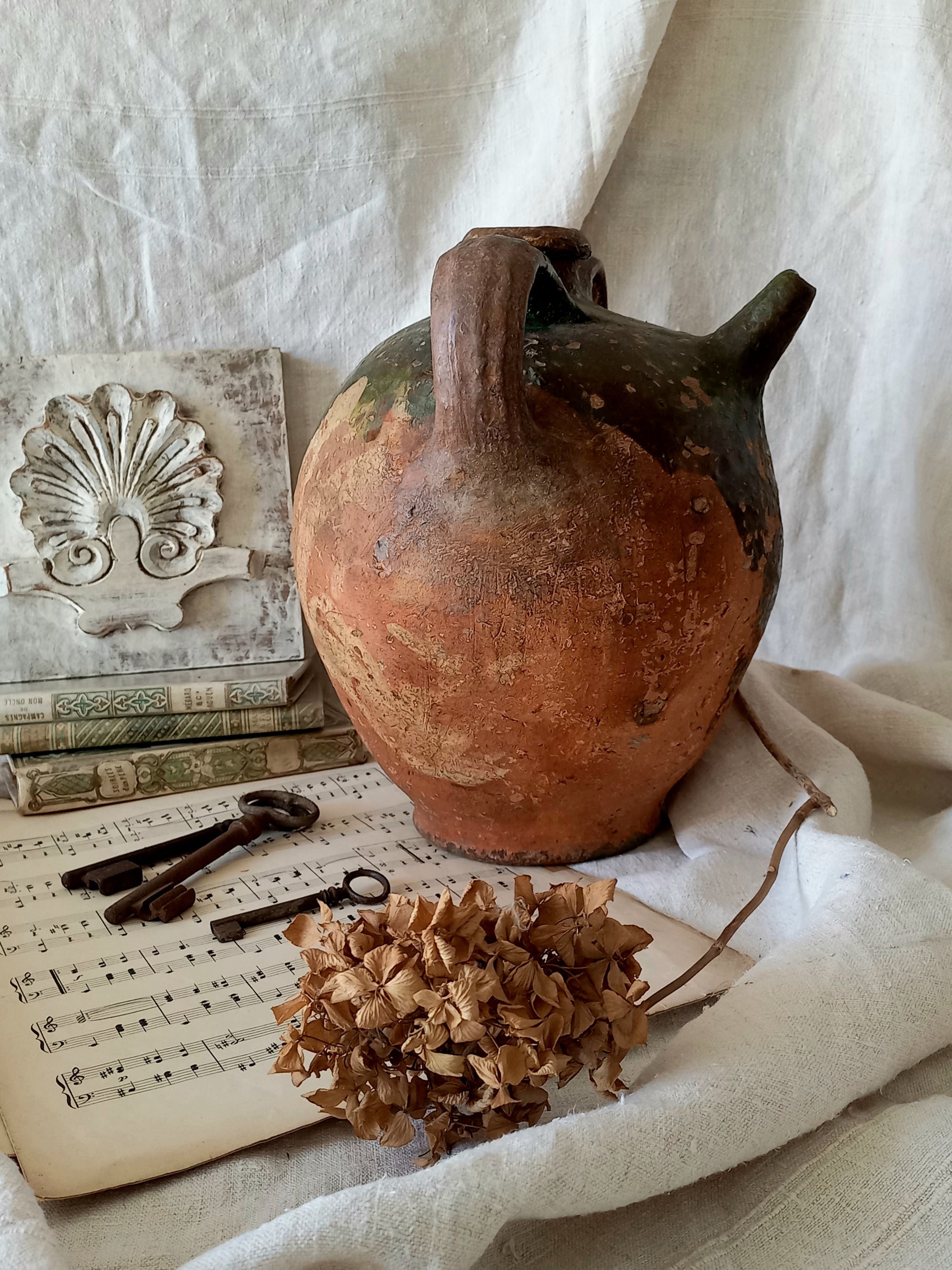 A stunning French antique stoneware terracotta oil preserving jar.