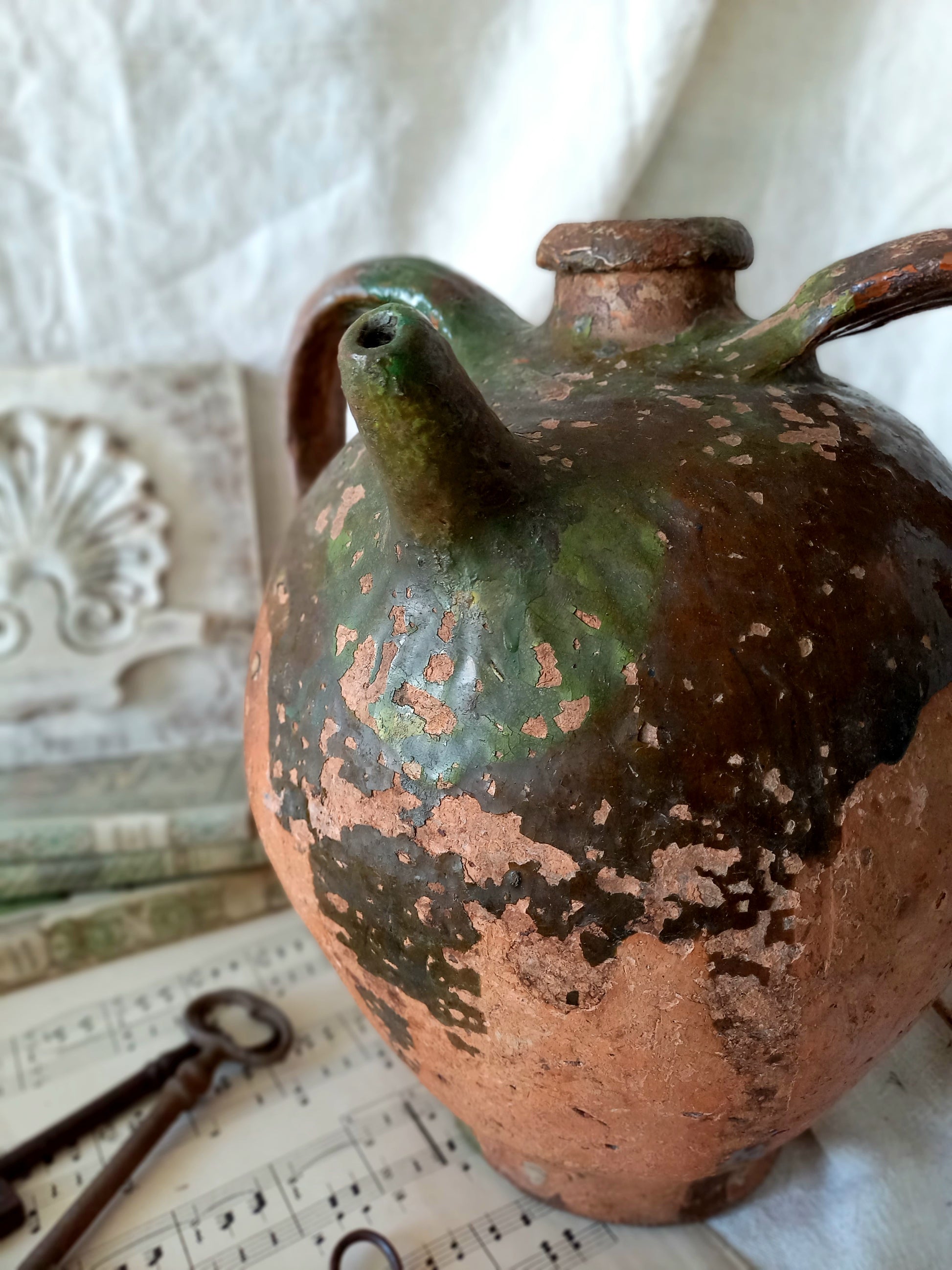 A stunning French antique stoneware terracotta oil preserving jar.