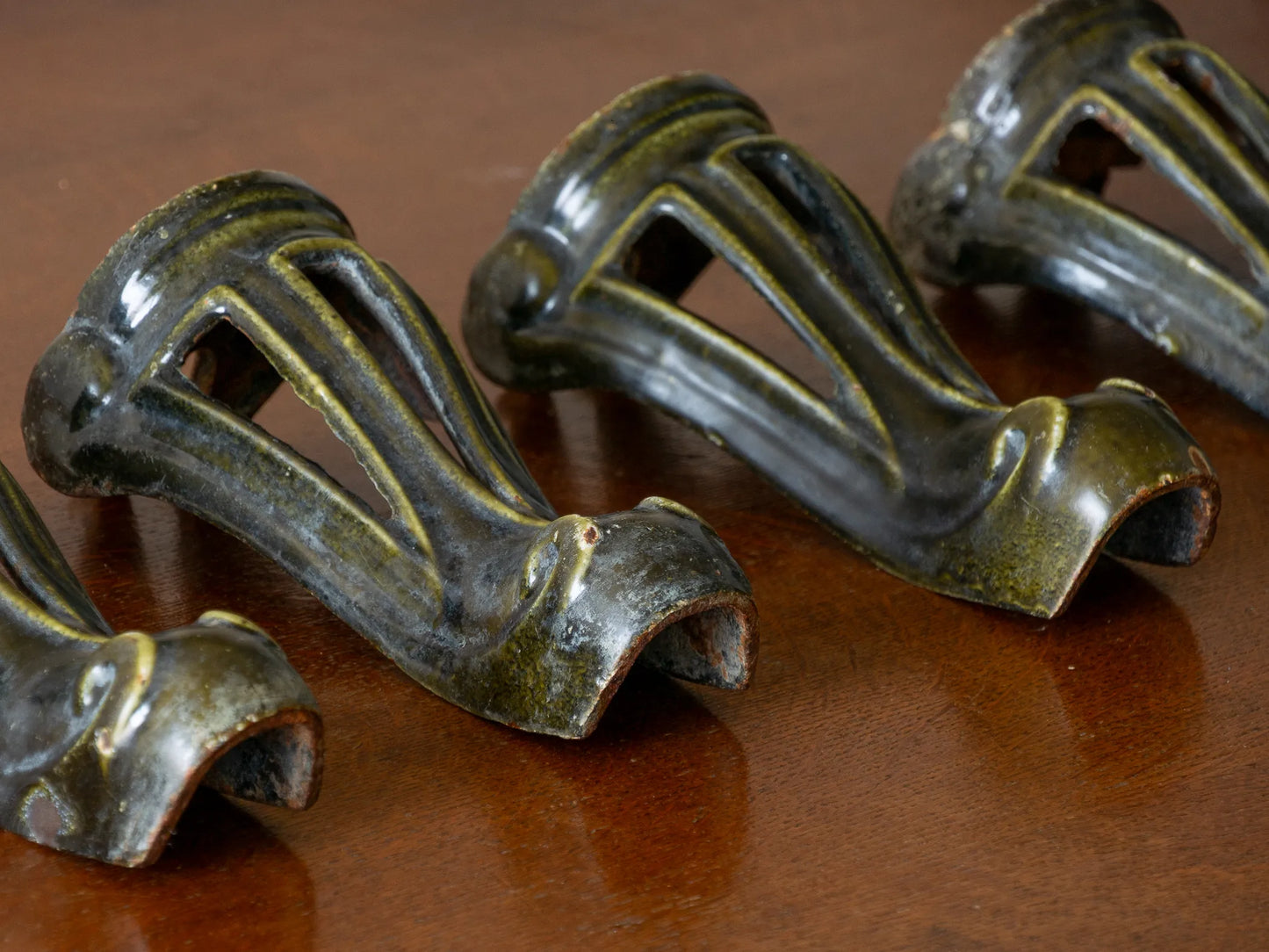 A set of 4 French vintage/antique cast iron bath feet / furniture feet with green enamel finishes, beautifully detailed and decorative pieces perfect for finishing a furniture project.