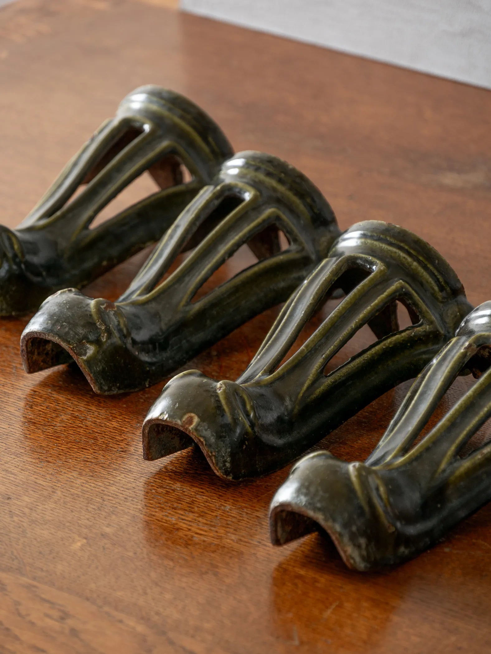 A set of 4 French vintage/antique cast iron bath feet / furniture feet with green enamel finishes, beautifully detailed and decorative pieces perfect for finishing a furniture project.