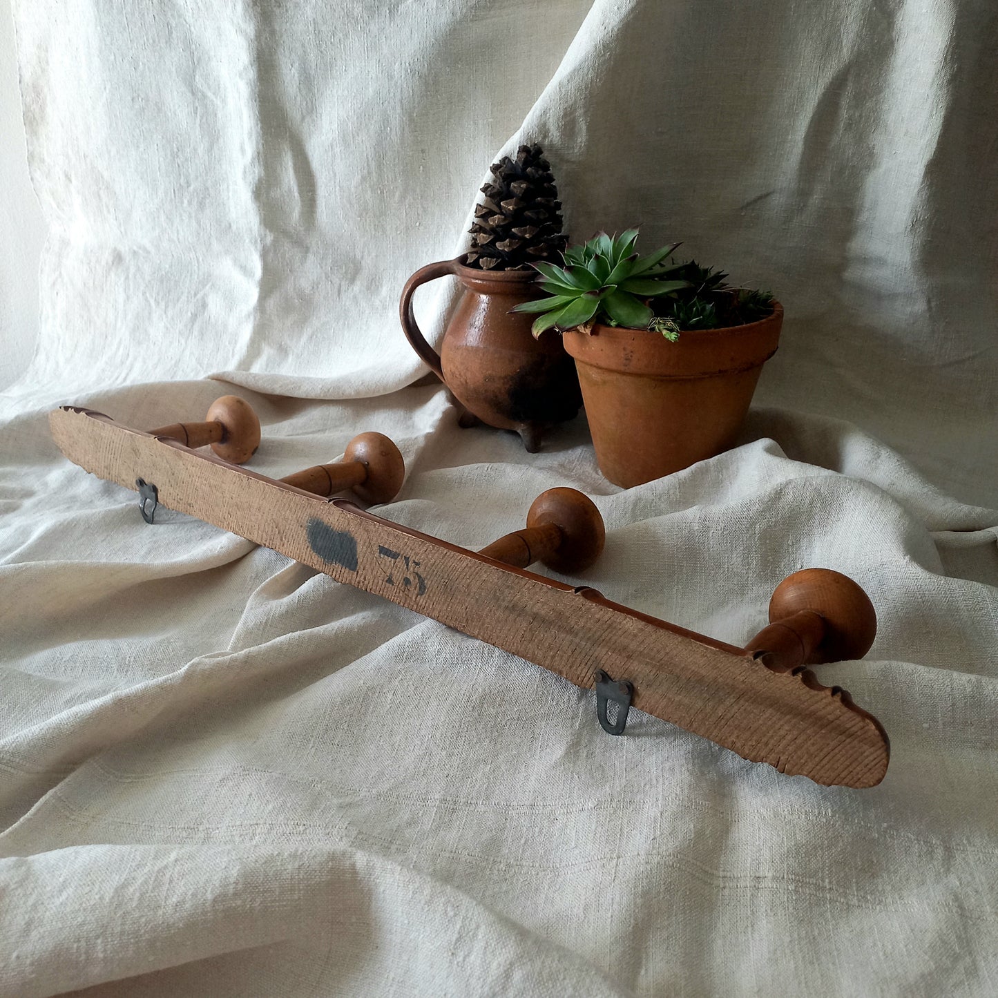 A French vintage faux bamboo wooden coat rack with 4 hanging hooks/pegs. These older type of faux bamboo coat racks are becoming increasingly difficult to source, especially in this excellent condition! There are two metal hanging hooks to the rear for mounting to your wall.

In summary, a wonderful piece of wall decor for any interior, and especially those of a country home, rustic or farmhouse style.