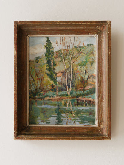 An original vintage landscape oil painting depicting a charming country home in among a wooded area with hills in the background. In the foreground a gentle river reflects the trees in the background.

The painting has been painted by an experienced artist with confident brush strokes - a really wonderful piece of original art.

The painting is presented in an old worn wooden frame which we love and think others will too - it really suits this piece. 