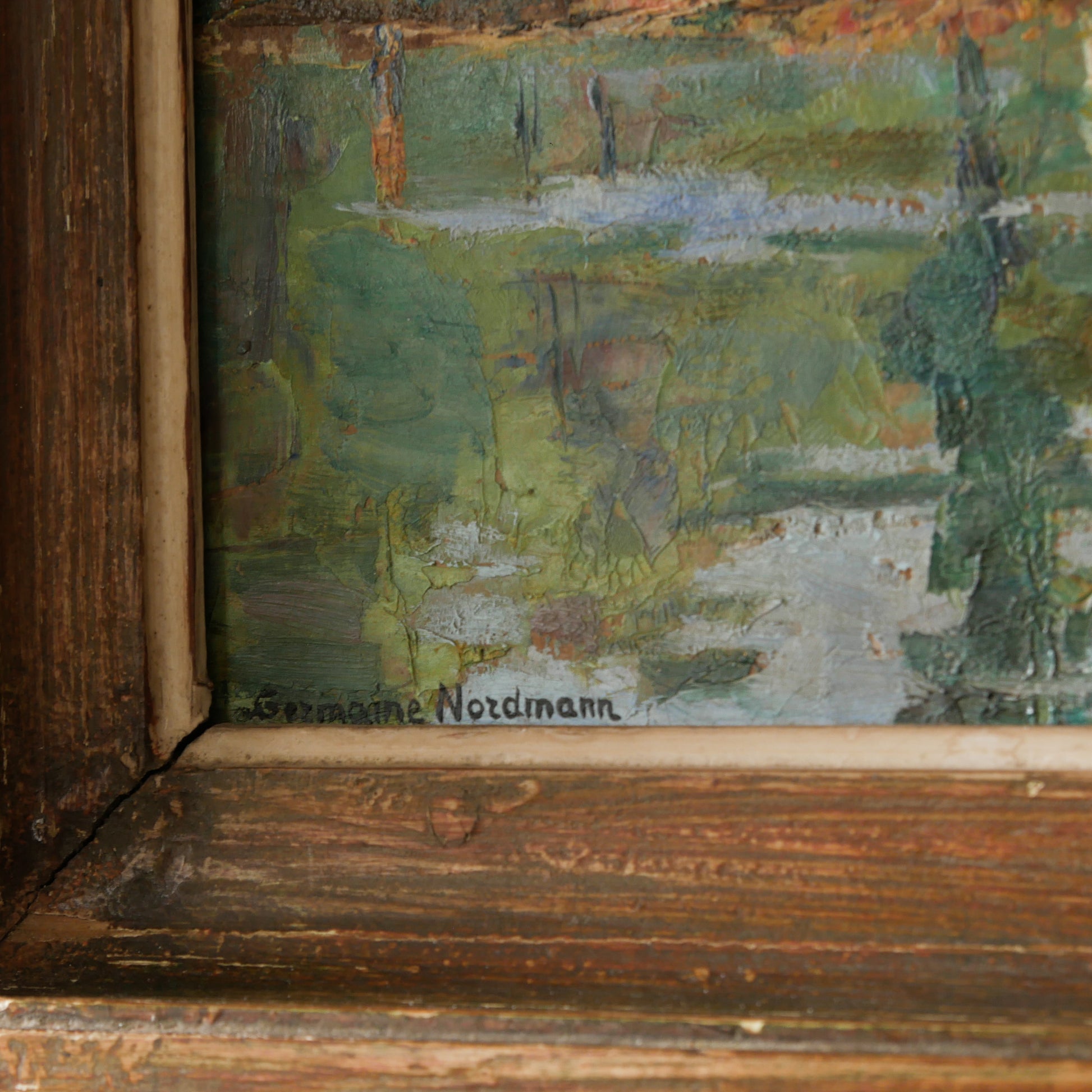 An original vintage landscape oil painting depicting a charming country home in among a wooded area with hills in the background. In the foreground a gentle river reflects the trees in the background.

The painting has been painted by an experienced artist with confident brush strokes - a really wonderful piece of original art.

The painting is presented in an old worn wooden frame which we love and think others will too - it really suits this piece. 