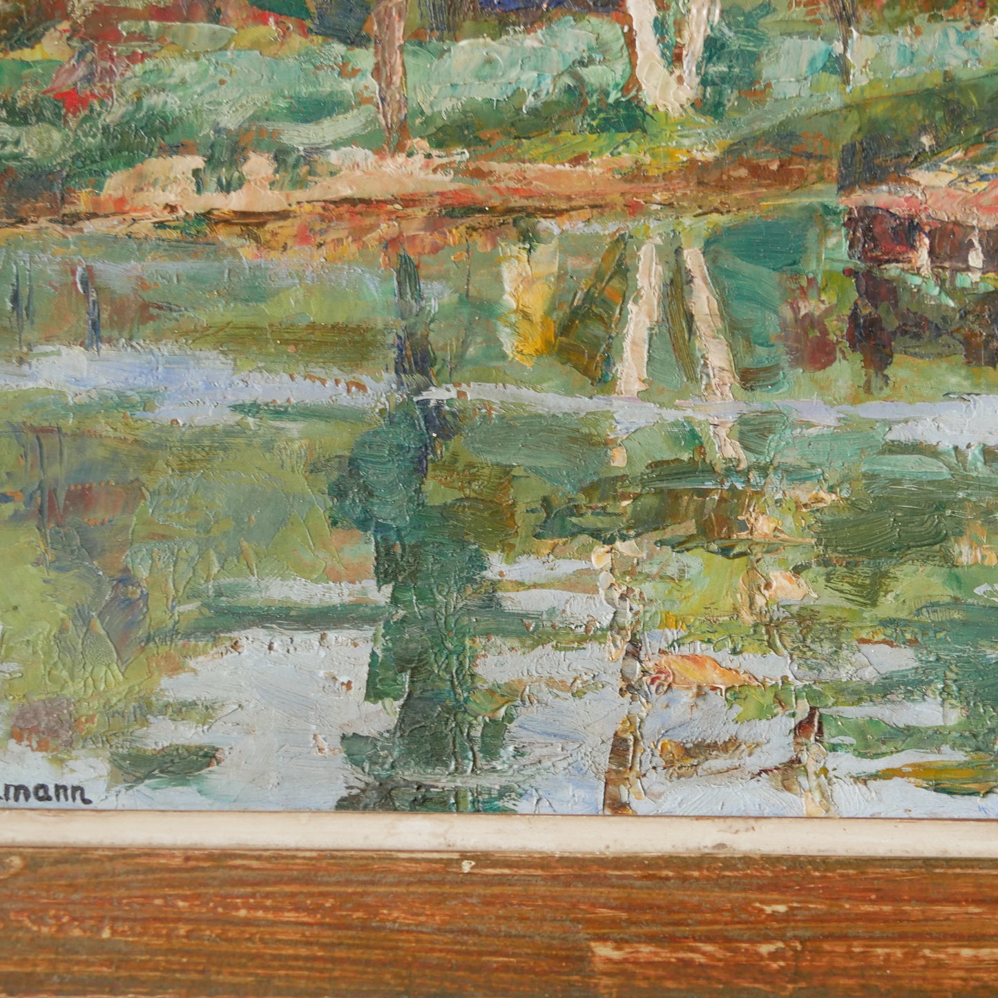 An original vintage landscape oil painting depicting a charming country home in among a wooded area with hills in the background. In the foreground a gentle river reflects the trees in the background.

The painting has been painted by an experienced artist with confident brush strokes - a really wonderful piece of original art.

The painting is presented in an old worn wooden frame which we love and think others will too - it really suits this piece. 