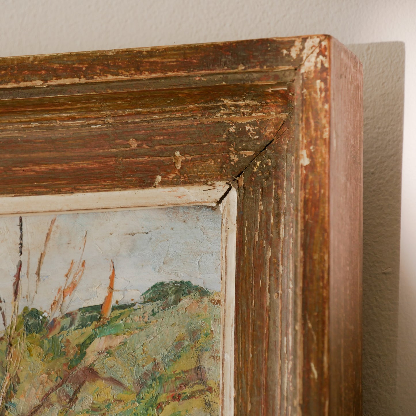 An original vintage landscape oil painting depicting a charming country home in among a wooded area with hills in the background. In the foreground a gentle river reflects the trees in the background.

The painting has been painted by an experienced artist with confident brush strokes - a really wonderful piece of original art.

The painting is presented in an old worn wooden frame which we love and think others will too - it really suits this piece. 