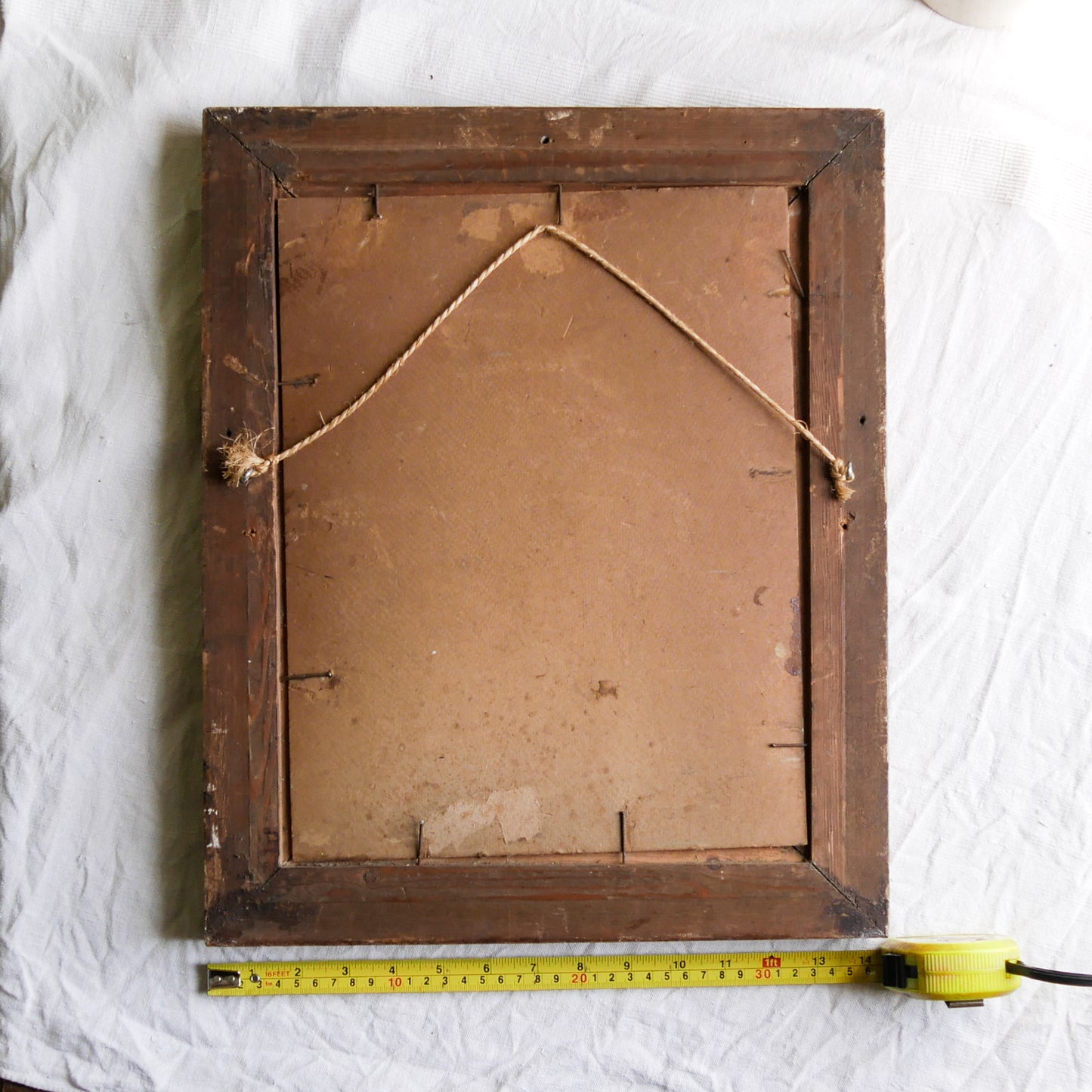 An original vintage landscape oil painting depicting a charming country home in among a wooded area with hills in the background. In the foreground a gentle river reflects the trees in the background.

The painting has been painted by an experienced artist with confident brush strokes - a really wonderful piece of original art.

The painting is presented in an old worn wooden frame which we love and think others will too - it really suits this piece. 