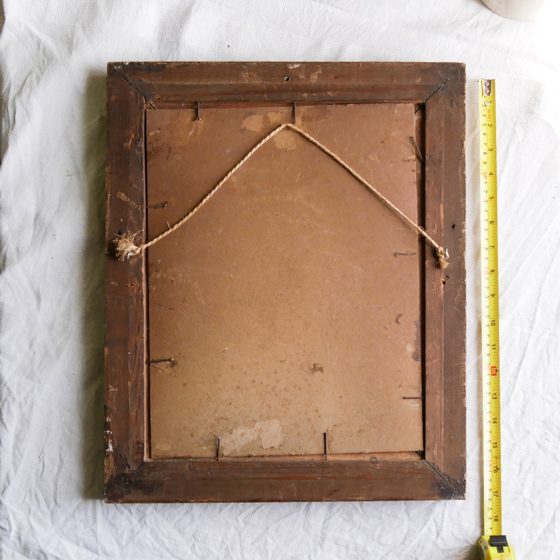 An original vintage landscape oil painting depicting a charming country home in among a wooded area with hills in the background. In the foreground a gentle river reflects the trees in the background.

The painting has been painted by an experienced artist with confident brush strokes - a really wonderful piece of original art.

The painting is presented in an old worn wooden frame which we love and think others will too - it really suits this piece. 