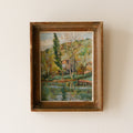 An original vintage landscape oil painting depicting a charming country home in among a wooded area with hills in the background. In the foreground a gentle river reflects the trees in the background.

The painting has been painted by an experienced artist with confident brush strokes - a really wonderful piece of original art.

The painting is presented in an old worn wooden frame which we love and think others will too - it really suits this piece. 