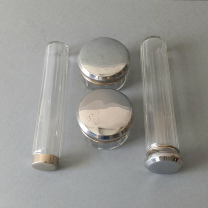 A set of 4 small French vintage decorative glass perfume/scent bottles/make-up containers that will make pleasing decorative pieces in your interior.