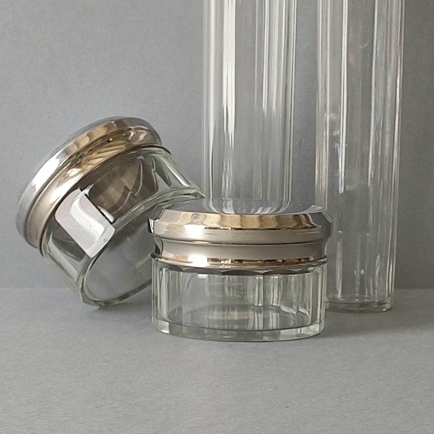 A set of 4 small French vintage decorative glass perfume/scent bottles/make-up containers that will make pleasing decorative pieces in your interior.