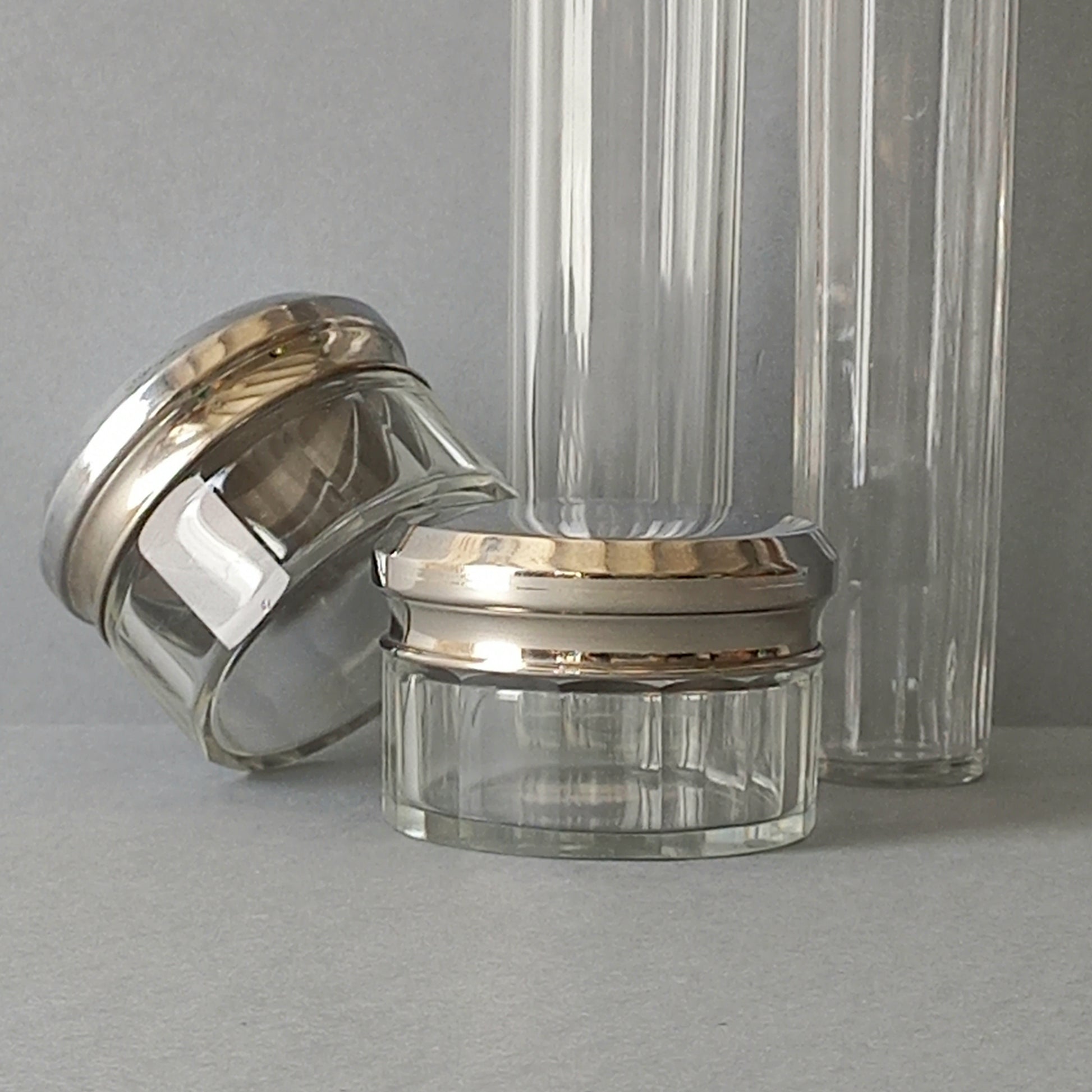 A set of 4 small French vintage decorative glass perfume/scent bottles/make-up containers that will make pleasing decorative pieces in your interior.