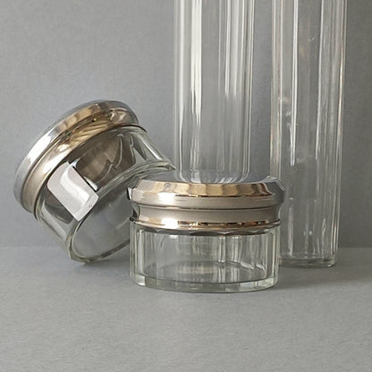 A set of 4 small French vintage decorative glass perfume/scent bottles/make-up containers that will make pleasing decorative pieces in your interior.