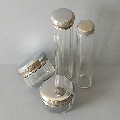 A set of 4 small French vintage decorative glass perfume/scent bottles/make-up containers that will make pleasing decorative pieces in your interior.