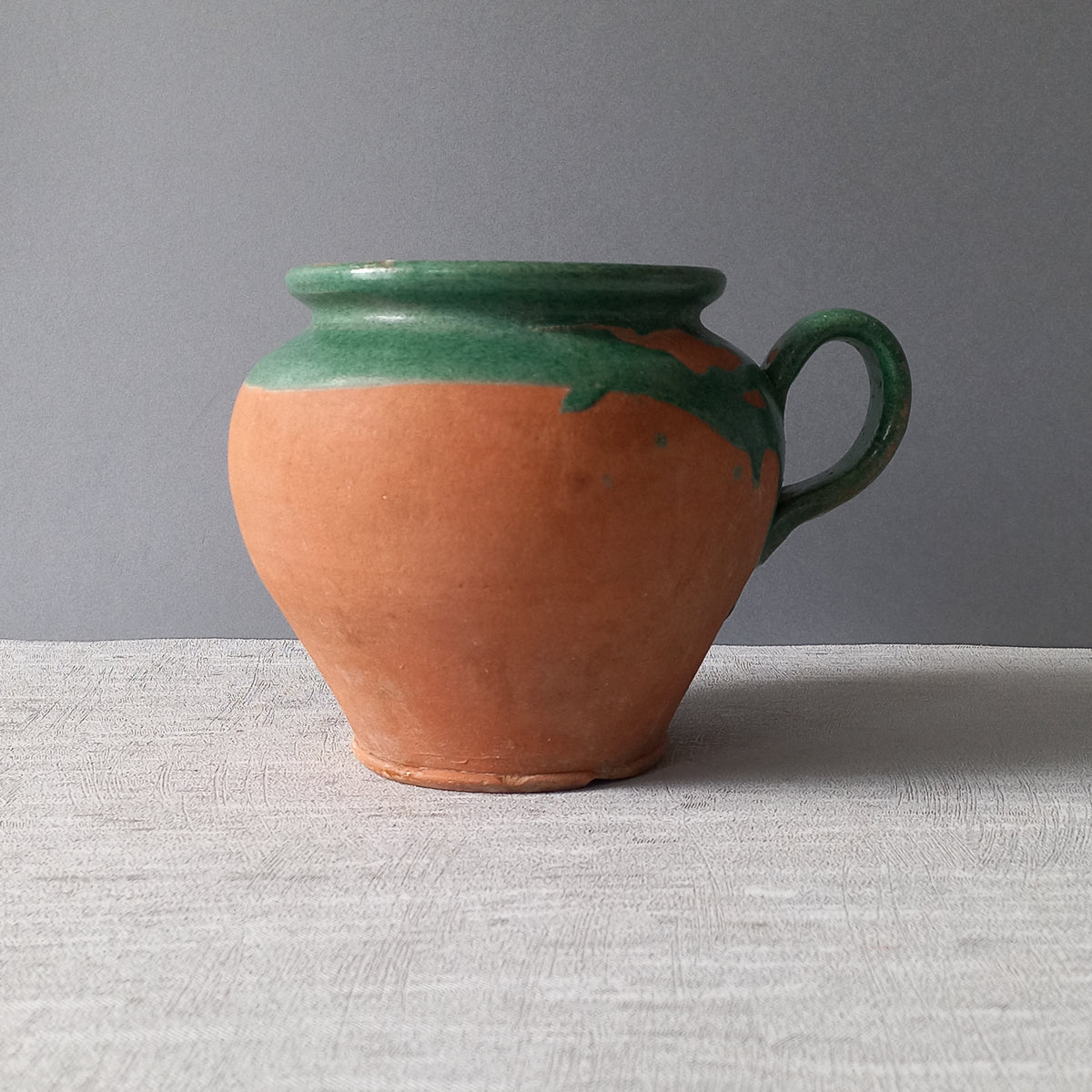 Small French vintage pottery jug with green glazed interior