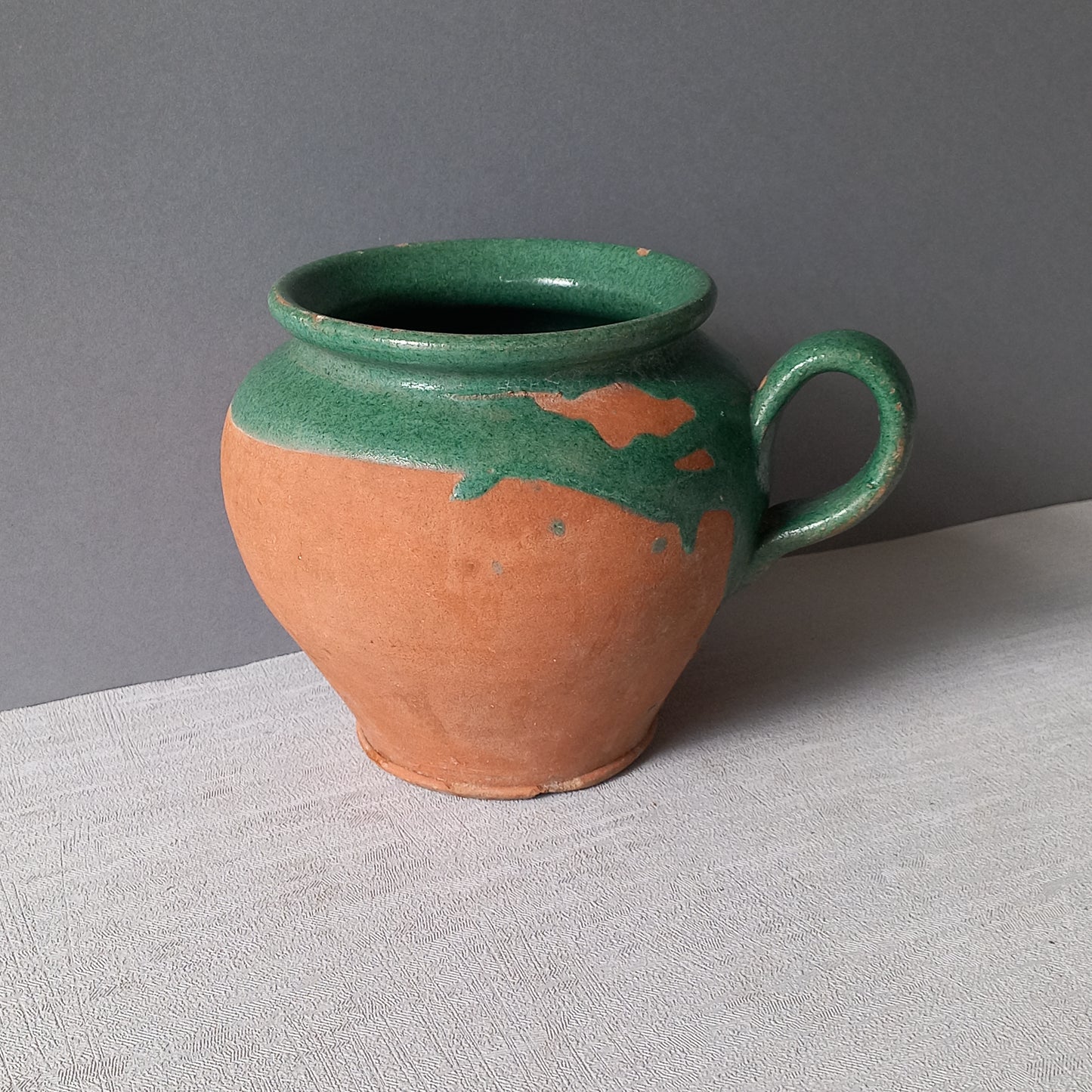 Small French vintage pottery jug with green glazed interior