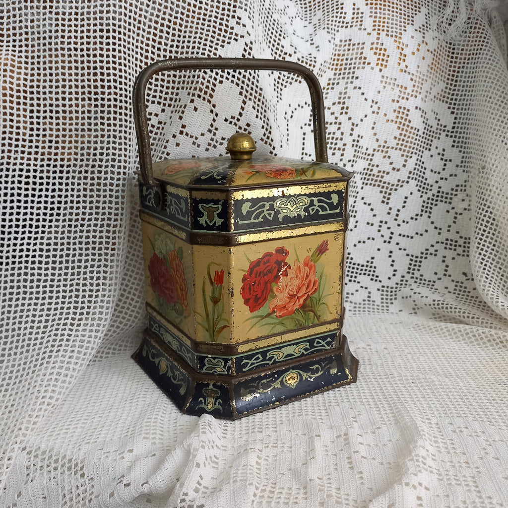Decorative antique tin box with floral pattern