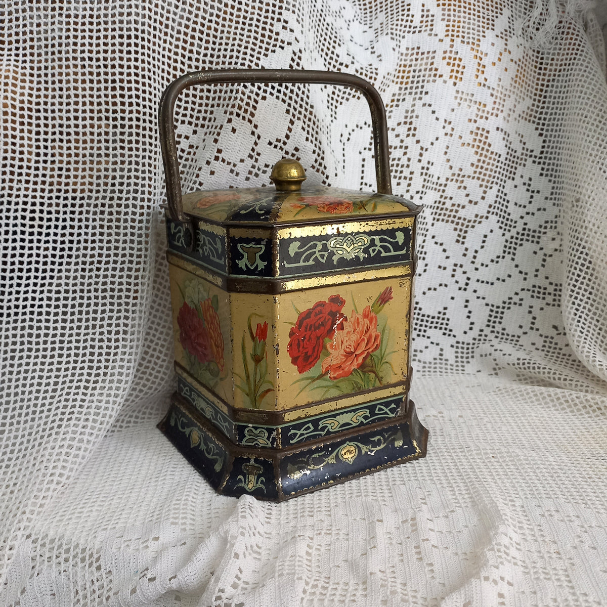 Decorative antique tin box with floral pattern