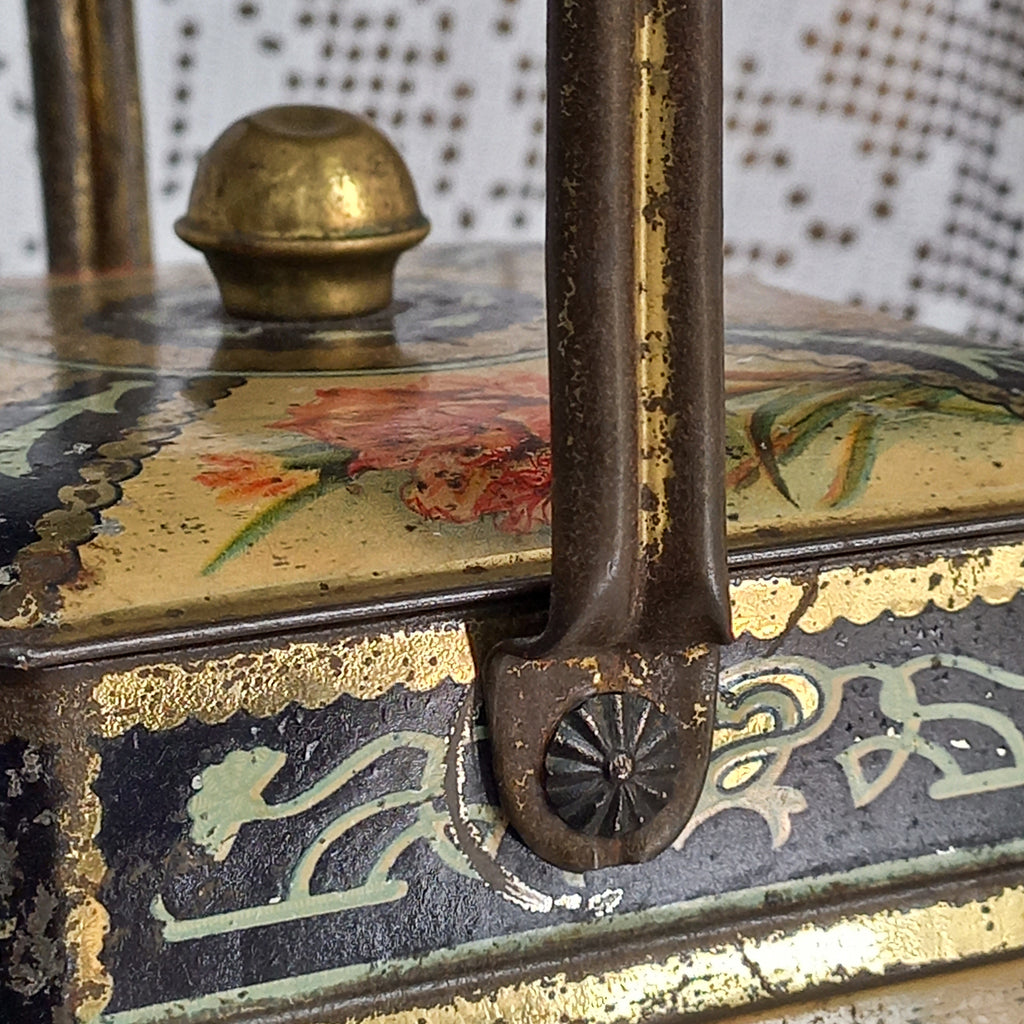 Decorative antique tin box with floral pattern