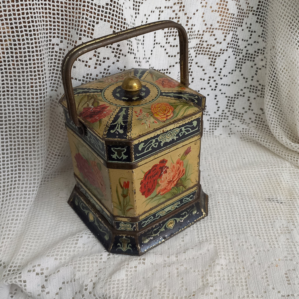 Decorative antique tin box with floral pattern