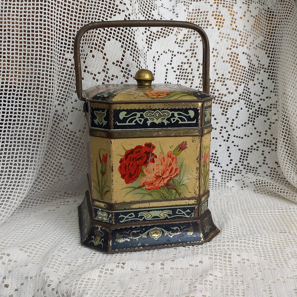 Decorative antique tin box with floral pattern