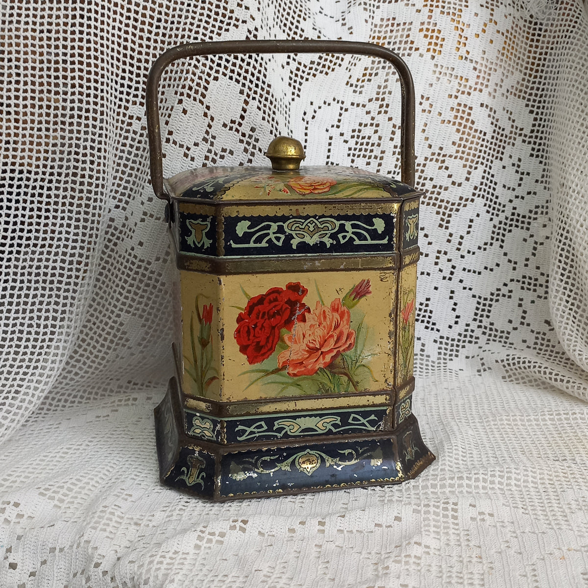 Decorative antique tin box with floral pattern