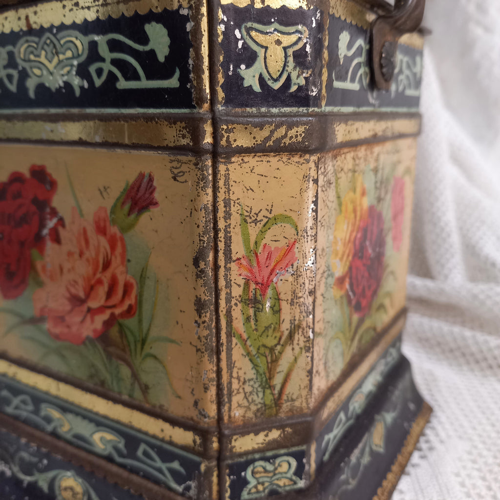 Decorative antique tin box with floral pattern