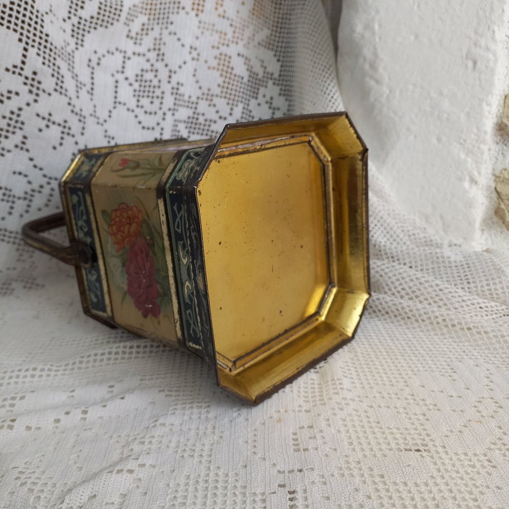 Decorative antique tin box with floral pattern