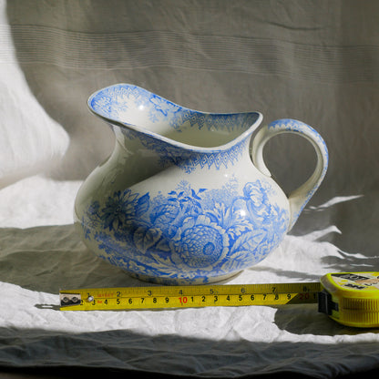 A beautiful French antique white ironstone jug with a pretty floral blue pattern. Once used as wash jugs these days these lovely old jugs make super pieces of home decor. The maker's mark is clearly identified underneath. A wonderful piece of antique ironstone!

Circa: late 1800s/early 1900s.
