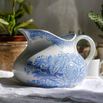 A beautiful French antique white ironstone jug with a pretty floral blue pattern. Once used as wash jugs these days these lovely old jugs make super pieces of home decor. The maker's mark is clearly identified underneath. A wonderful piece of antique ironstone!

Circa: late 1800s/early 1900s.