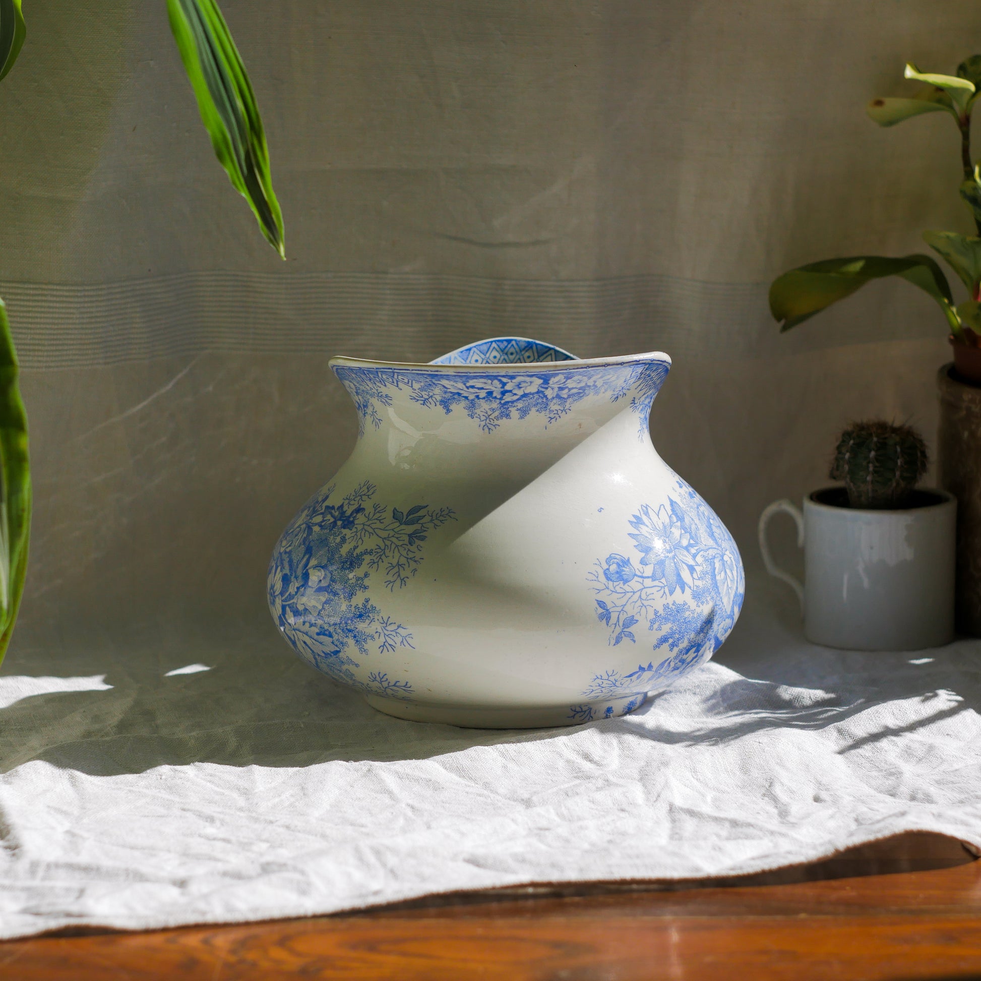 A beautiful French antique white ironstone jug with a pretty floral blue pattern. Once used as wash jugs these days these lovely old jugs make super pieces of home decor. The maker's mark is clearly identified underneath. A wonderful piece of antique ironstone!

Circa: late 1800s/early 1900s.
