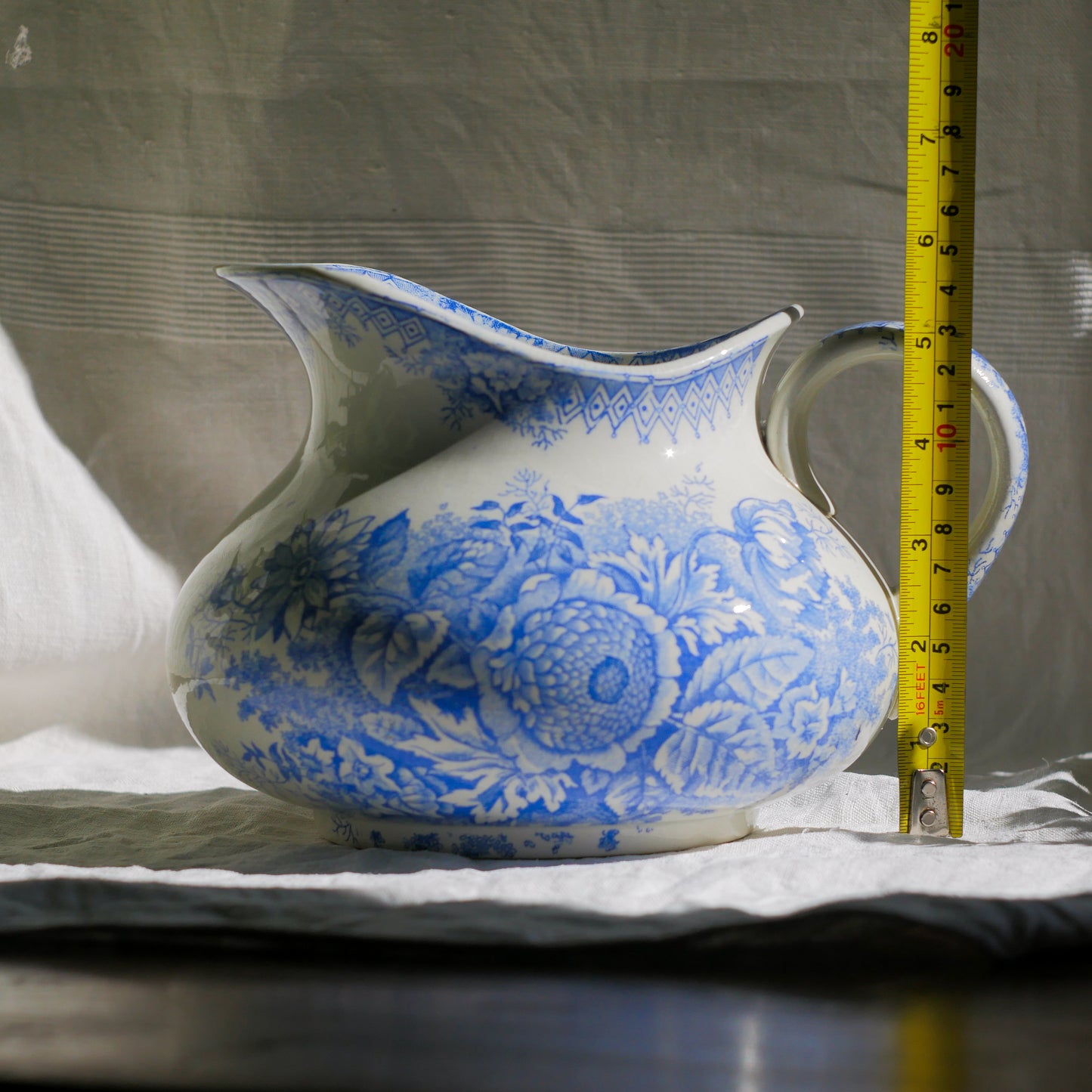 A beautiful French antique white ironstone jug with a pretty floral blue pattern. Once used as wash jugs these days these lovely old jugs make super pieces of home decor. The maker's mark is clearly identified underneath. A wonderful piece of antique ironstone!

Circa: late 1800s/early 1900s.